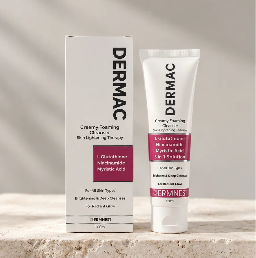 DERMAC Creamy Foaming Cleanser 100ml carton and tube by DERMNEST on a stone surface